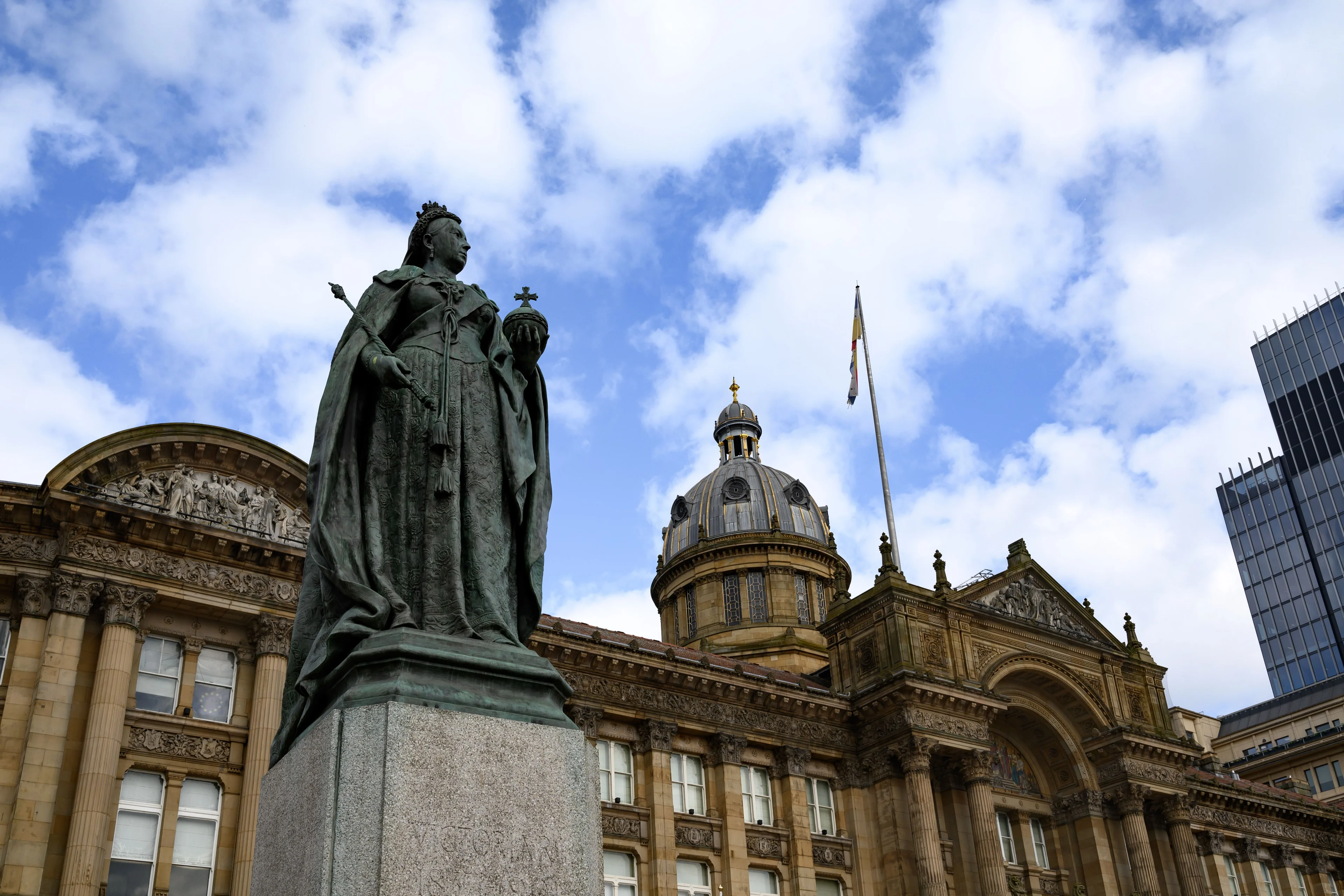 The statue of Queen Victoria in front of Birmingham Council House and its dome in Victoria Square