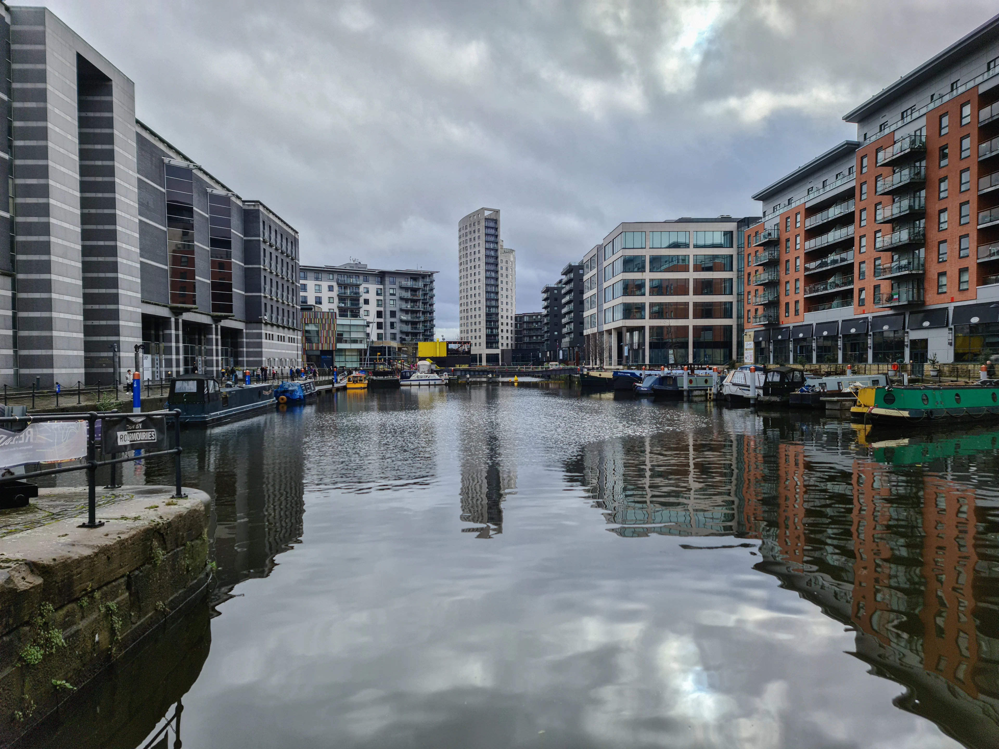 Contemporary apartment and office buildings lining the water at Leeds Dock